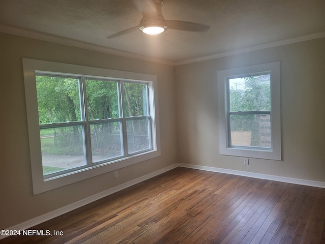 spare room featuring hardwood / wood-style flooring, ceiling fan, crown molding, and a textured ceiling