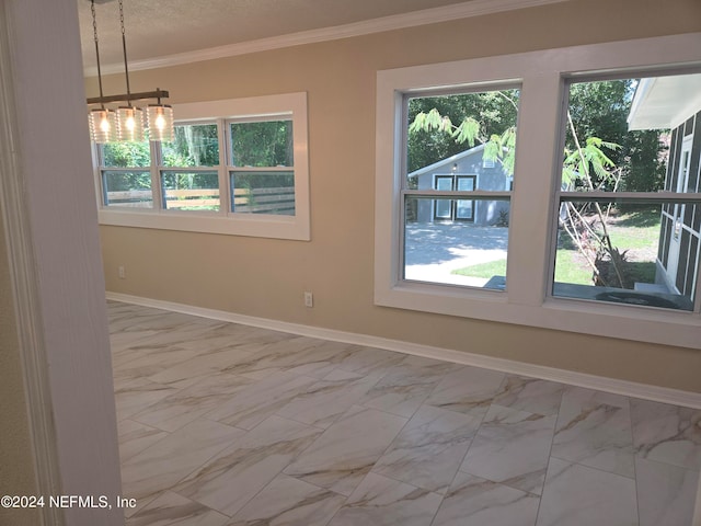 unfurnished room featuring crown molding and plenty of natural light