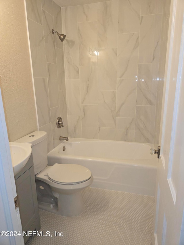 full bathroom featuring vanity, toilet, and tiled shower / bath combo