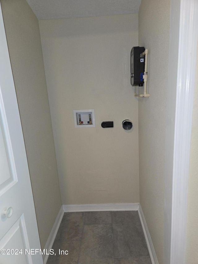 laundry area with washer hookup, laundry area, and baseboards