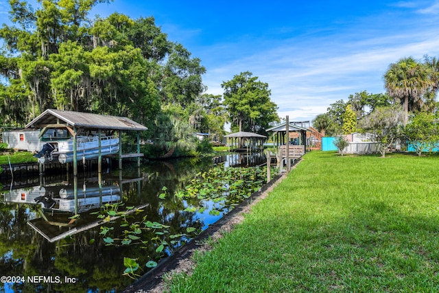 view of yard featuring a dock