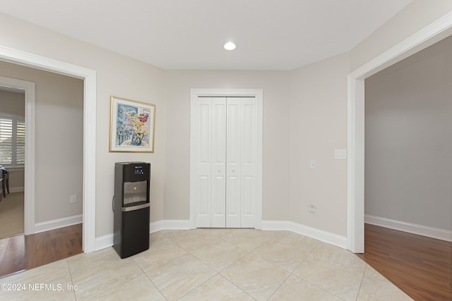 bedroom featuring light tile patterned flooring and a closet