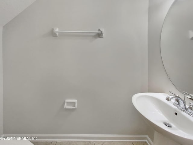 bathroom with tile patterned flooring and sink