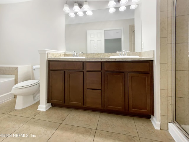 full bathroom with toilet, vanity, and tile patterned floors