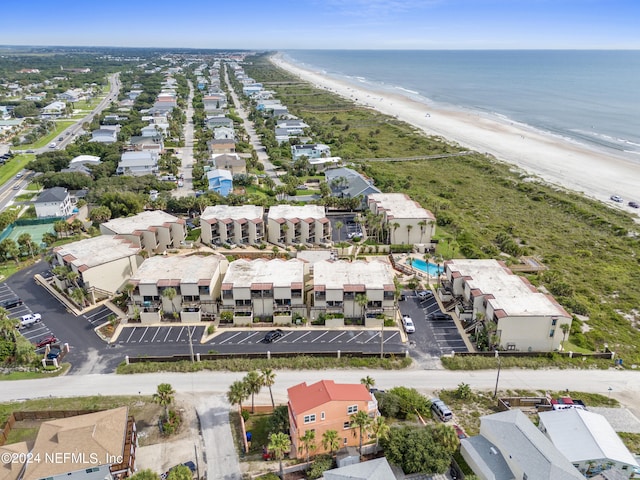 bird's eye view with a water view and a view of the beach