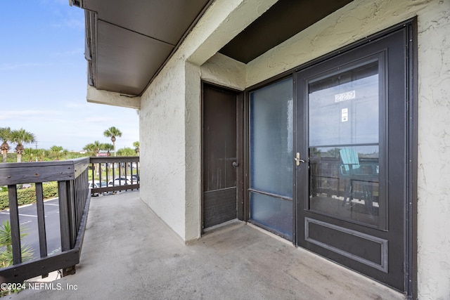 entrance to property featuring a balcony