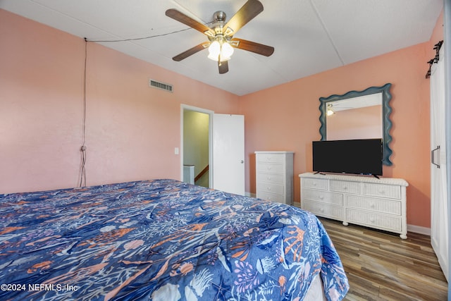 bedroom featuring ceiling fan and dark hardwood / wood-style floors