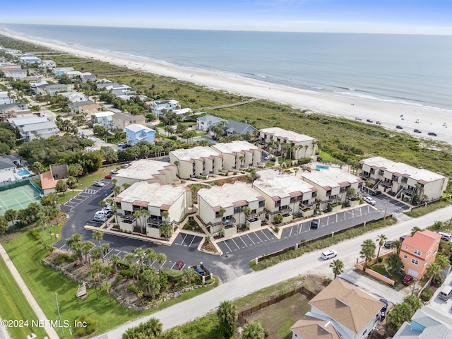 aerial view with a water view and a view of the beach