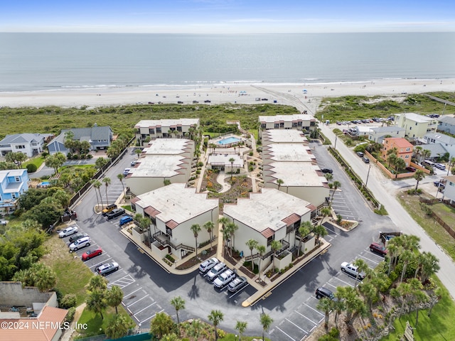 bird's eye view with a beach view and a water view