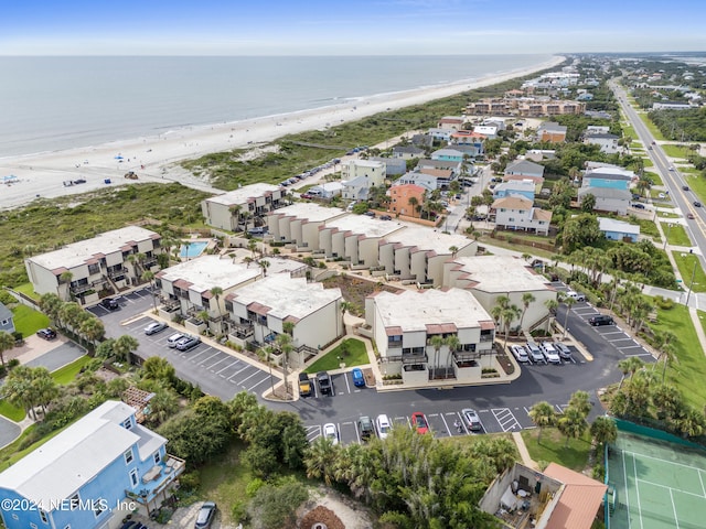 aerial view with a water view and a beach view