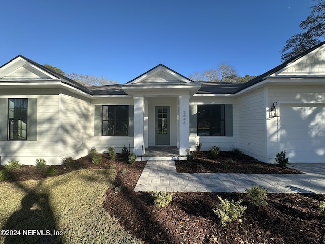 view of front of property with a garage