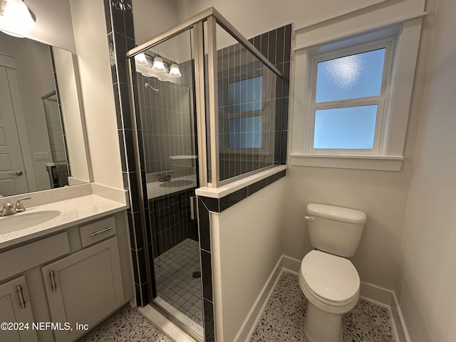 bathroom with vanity, toilet, and walk in shower