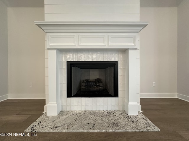 interior details with a fireplace and wood-type flooring