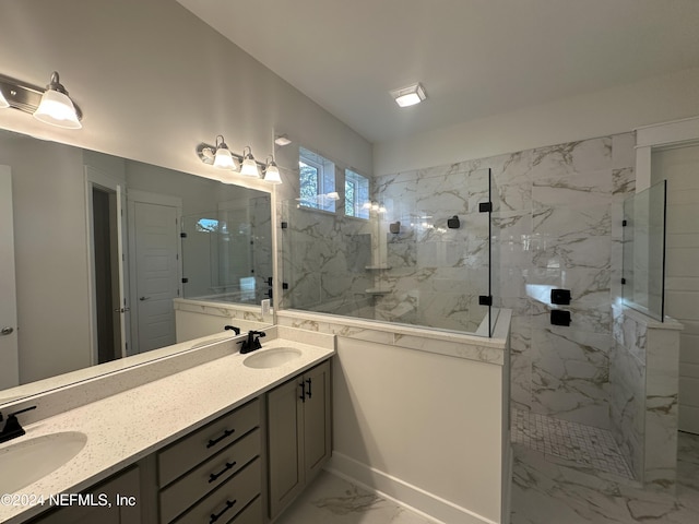 bathroom featuring vanity and tiled shower