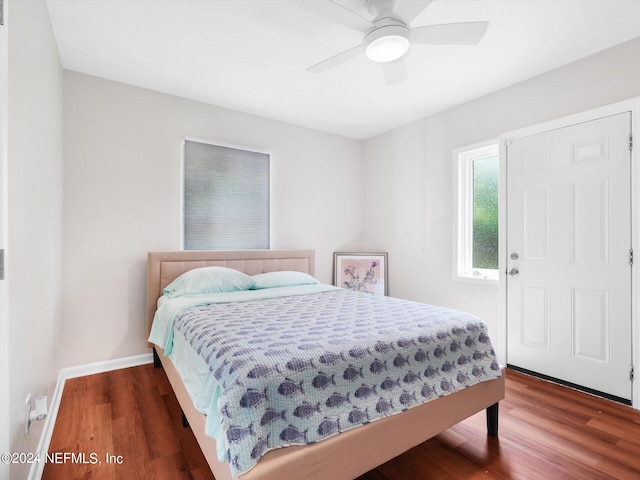 bedroom featuring dark wood-type flooring and ceiling fan