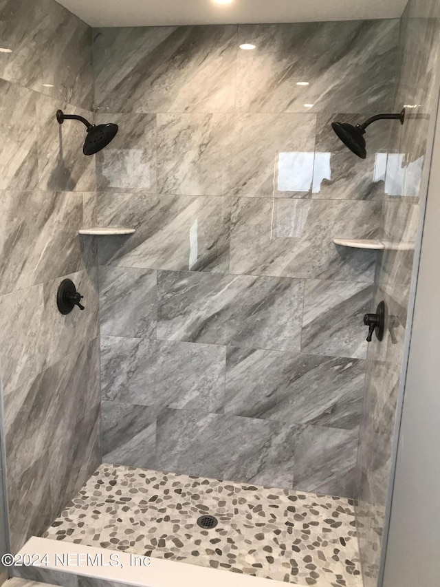 bathroom with tiled shower