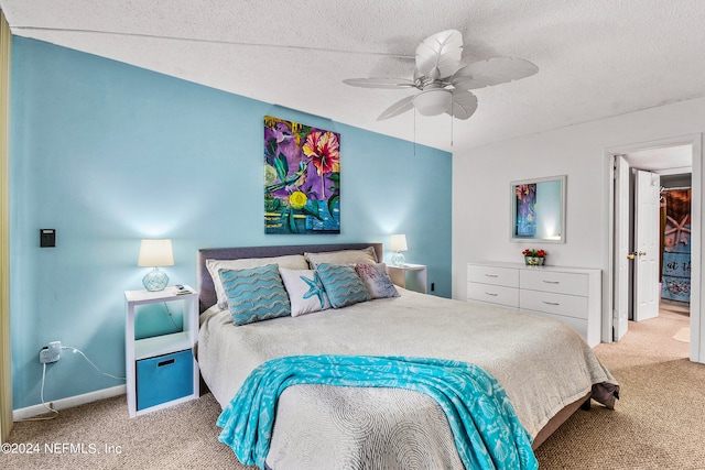 bedroom with carpet floors, a textured ceiling, and ceiling fan