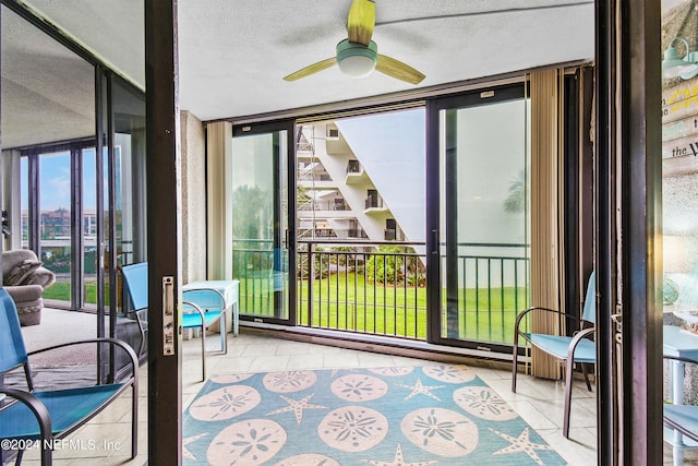 sunroom / solarium with ceiling fan