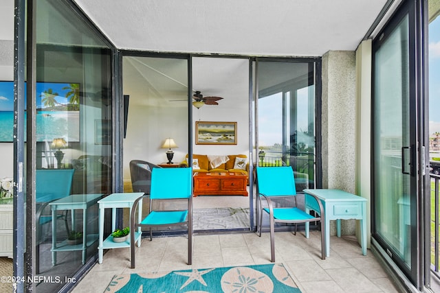 balcony with a patio and ceiling fan