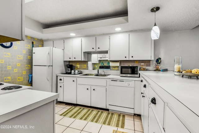 kitchen featuring white cabinetry, decorative light fixtures, white appliances, and light tile patterned floors