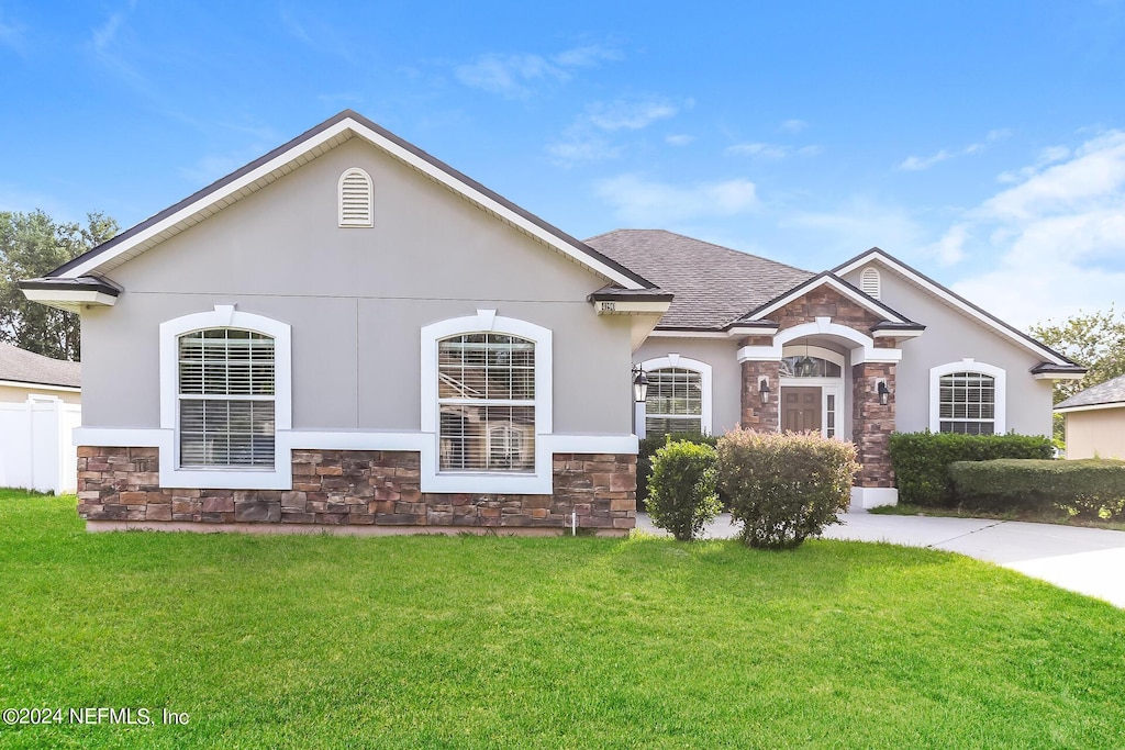 view of front of home with a front yard