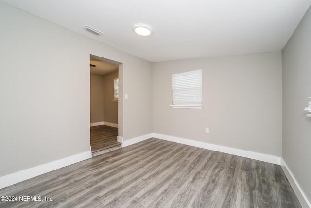 empty room with wood-type flooring