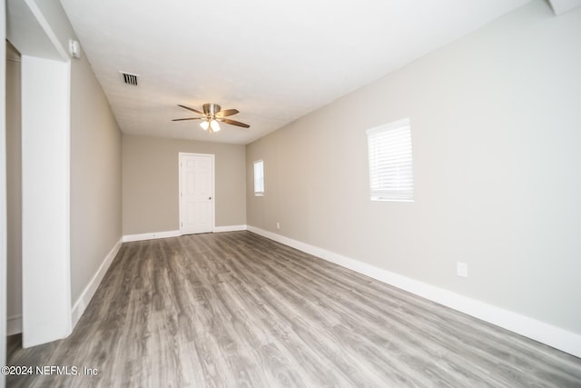 unfurnished room featuring ceiling fan and light hardwood / wood-style flooring