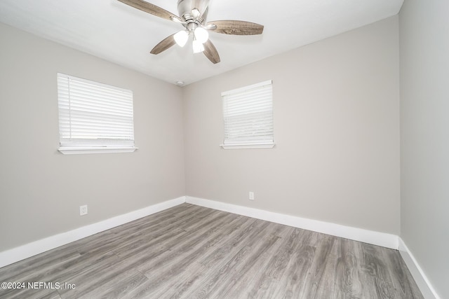 unfurnished room with light hardwood / wood-style flooring and ceiling fan