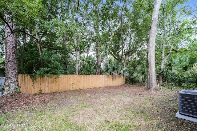 view of yard with central AC unit