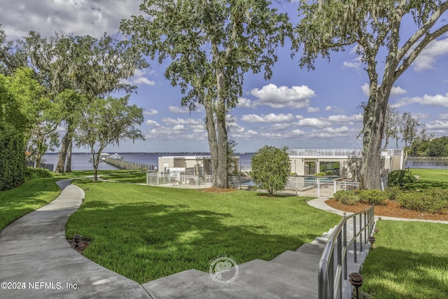 6000 San Jose Blvd Unit 11-C, Jacksonville, FL 32217 - surrounding community with a lawn, a water view, and fence