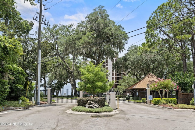 6000 San Jose Blvd Unit 11-C, Jacksonville, FL 32217 - view of road featuring a gated entry, a gate, and curbs