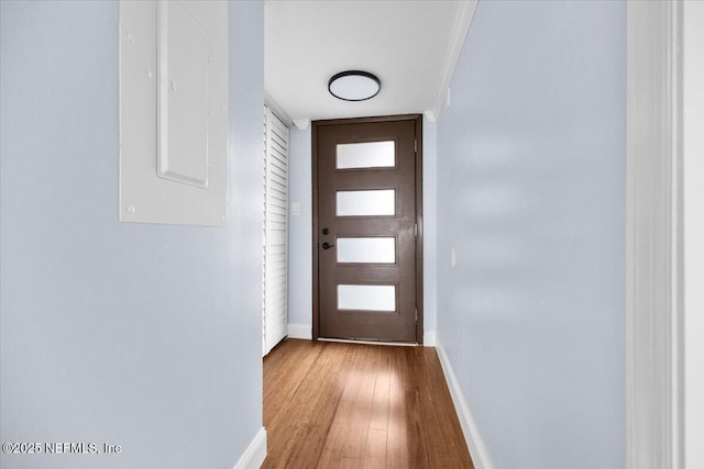 6000 San Jose Blvd Unit 11-C, Jacksonville, FL 32217 - doorway to outside with baseboards, wood finished floors, and electric panel