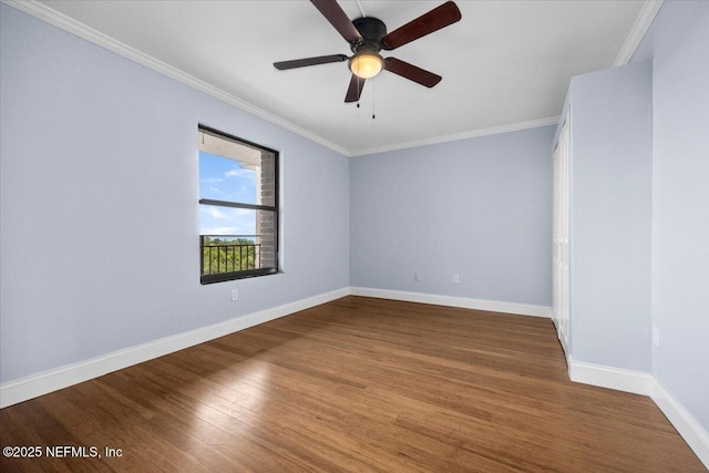 6000 San Jose Blvd Unit 11-C, Jacksonville, FL 32217 - empty room featuring crown molding, baseboards, a ceiling fan, and wood finished floors