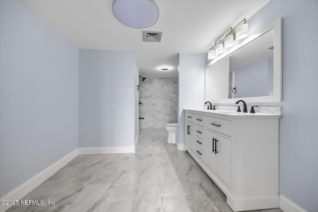 6000 San Jose Blvd Unit 11-C, Jacksonville, FL 32217 - full bathroom featuring visible vents, marble finish floor, toilet, baseboards, and walk in shower