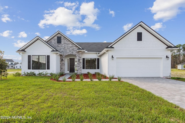 85425 Sandy Ridge Loop Unit 0085, Yulee, FL 32097 - view of front of property featuring stone siding, a front lawn, decorative driveway, and an attached garage