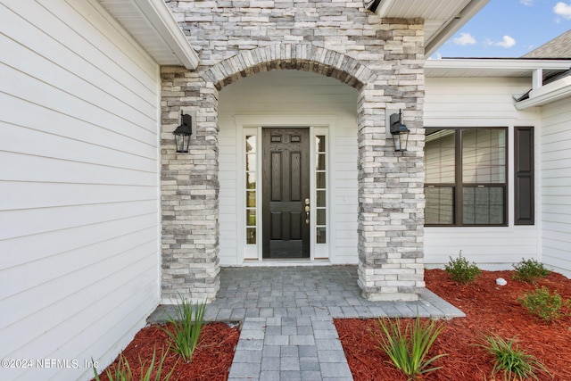 85425 Sandy Ridge Loop Unit 0085, Yulee, FL 32097 - doorway to property with stone siding