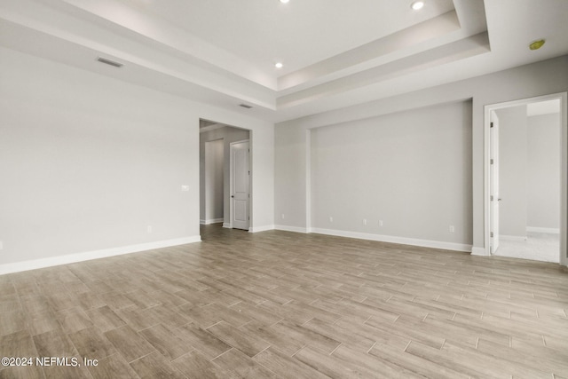 85425 Sandy Ridge Loop Unit 0085, Yulee, FL 32097 - empty room featuring baseboards, a tray ceiling, visible vents, and wood tiled floor