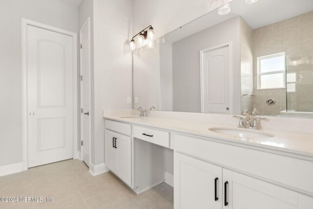 85425 Sandy Ridge Loop Unit 0085, Yulee, FL 32097 - bathroom featuring double vanity, walk in shower, tile patterned flooring, and a sink
