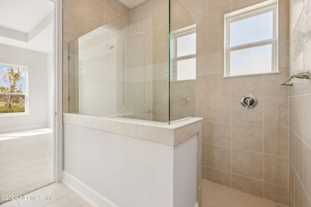85425 Sandy Ridge Loop Unit 0085, Yulee, FL 32097 - bathroom with walk in shower and tile patterned floors