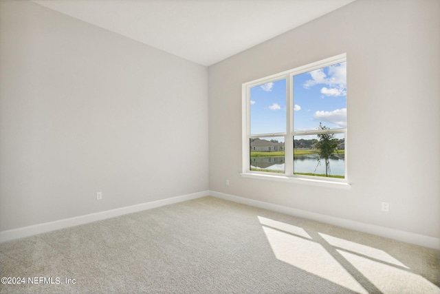 85425 Sandy Ridge Loop Unit 0085, Yulee, FL 32097 - unfurnished room featuring carpet floors, a water view, and baseboards