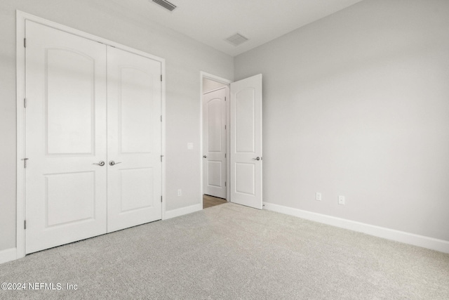 85425 Sandy Ridge Loop Unit 0085, Yulee, FL 32097 - unfurnished bedroom featuring carpet floors, a closet, visible vents, and baseboards