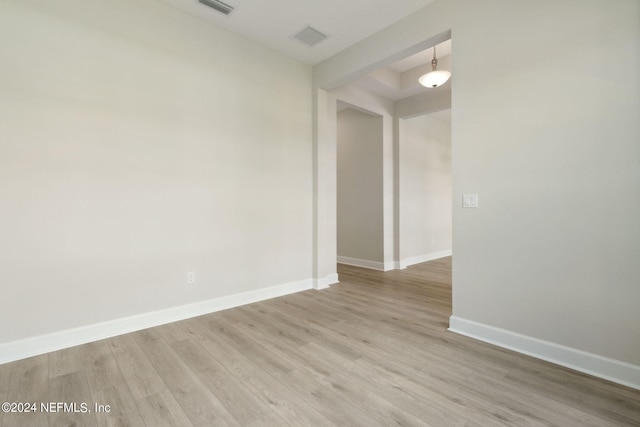 spare room featuring light hardwood / wood-style floors