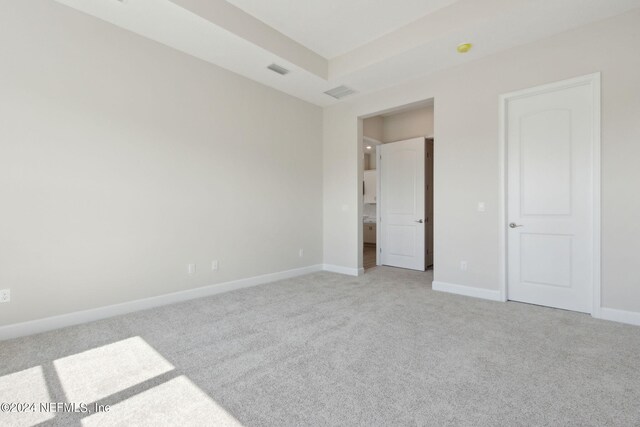 unfurnished bedroom with light carpet