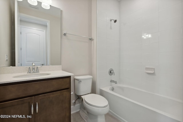 full bathroom with tiled shower / bath combo, vanity, and toilet