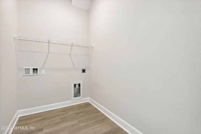 laundry area with washer hookup, electric dryer hookup, and hardwood / wood-style flooring