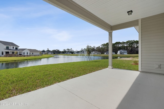 view of patio featuring a water view