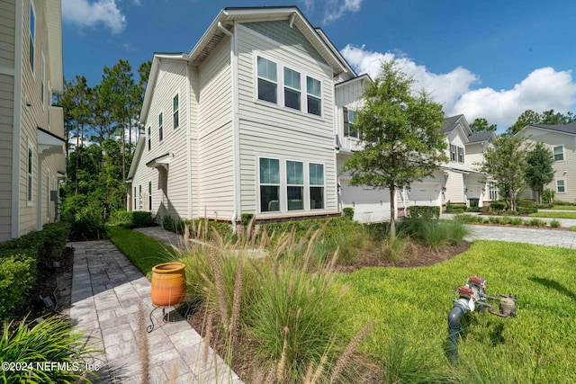 exterior space with a patio area and a lawn