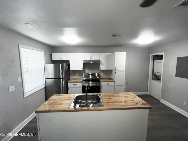 kitchen featuring stainless steel appliances, sink, white cabinets, and wood counters