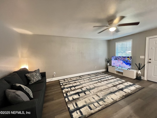 7815 Jasper Ave, Jacksonville, FL 32211 - living area featuring dark wood-style floors, baseboards, and ceiling fan