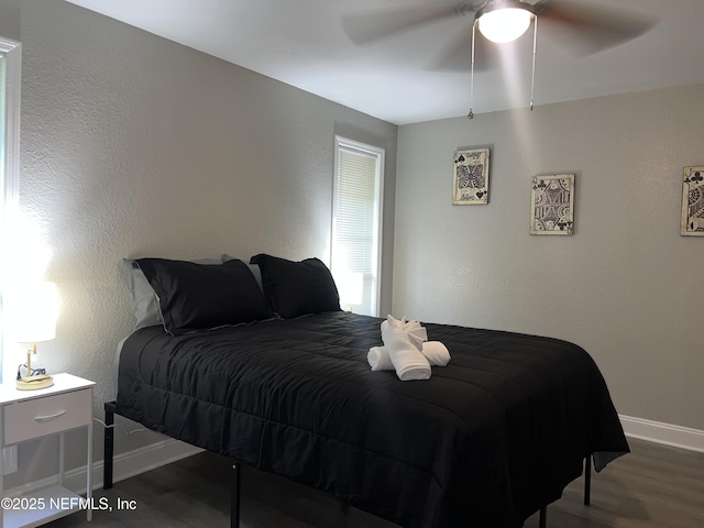 7815 Jasper Ave, Jacksonville, FL 32211 - bedroom featuring a ceiling fan, wood finished floors, and baseboards